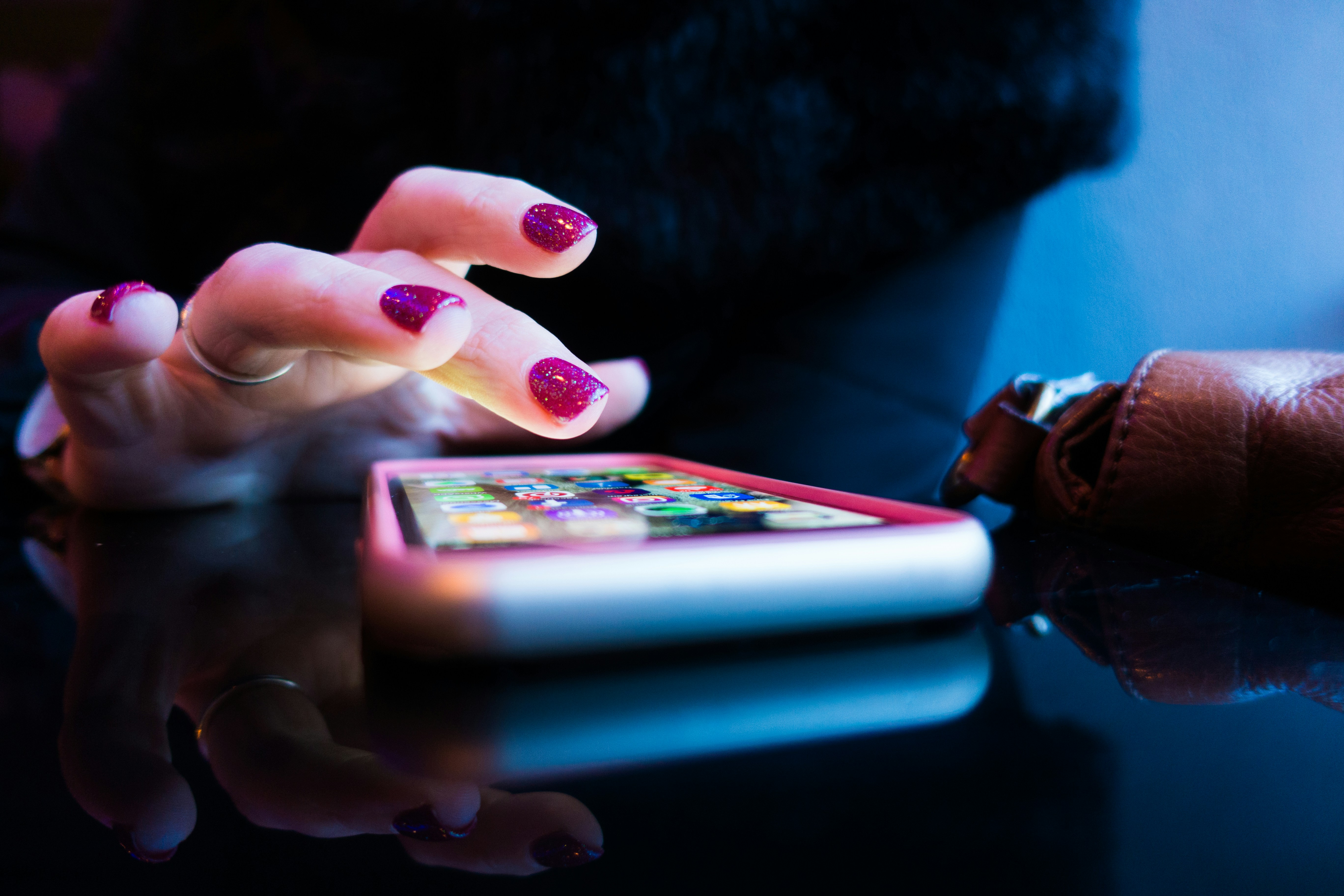 Person touching a mobile phone